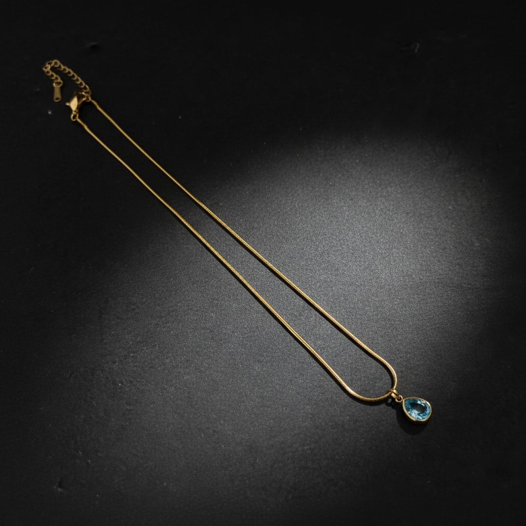 Golden Serenity Blue Topaz Teardrop Pendant Necklace